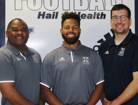 Coach Waterman (left) and Coach Svec (right) welcome new defensive back coach Micah Brown to the X-Men coaching staff